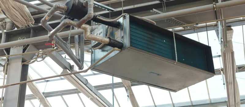 Industrial hvac unit hanging from ceiling structure — stock photo