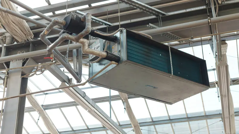 Industrial hvac unit hanging from ceiling structure — stock photo