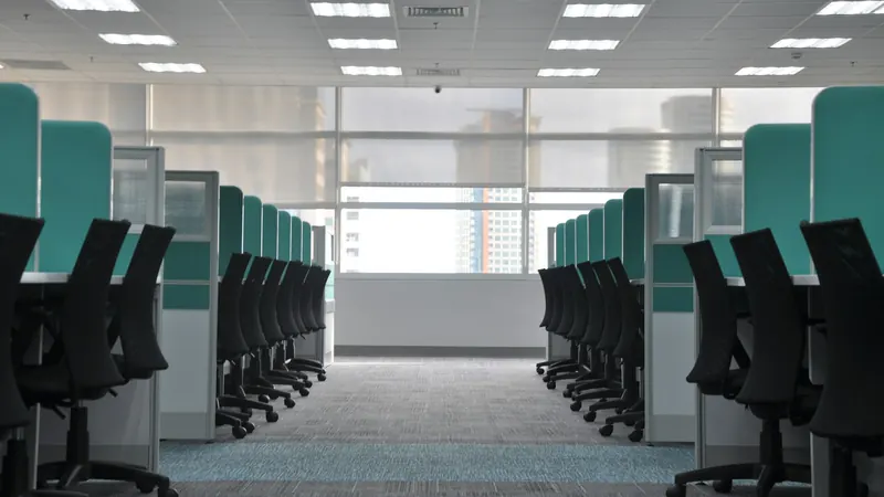 Empty black rolling chairs at cubicles — stock photo