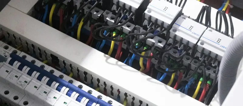 A bunch of wires are plugged into a switch box — stock photo
