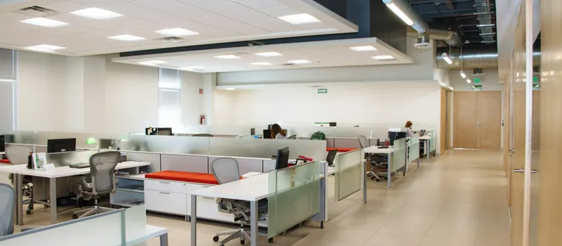 Office workspace with white desks — stock photo