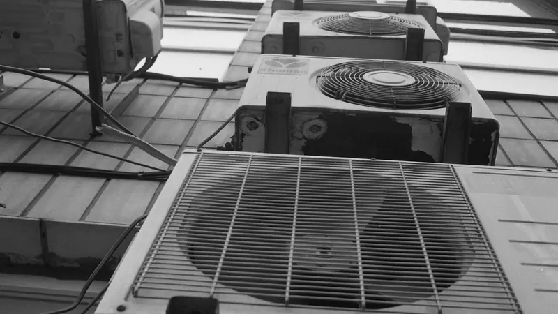 A row of air conditioners sitting on top of a tiled floor — stock photo