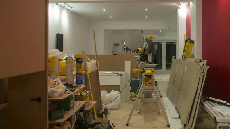 A room that is being remodeled with red walls — stock photo
